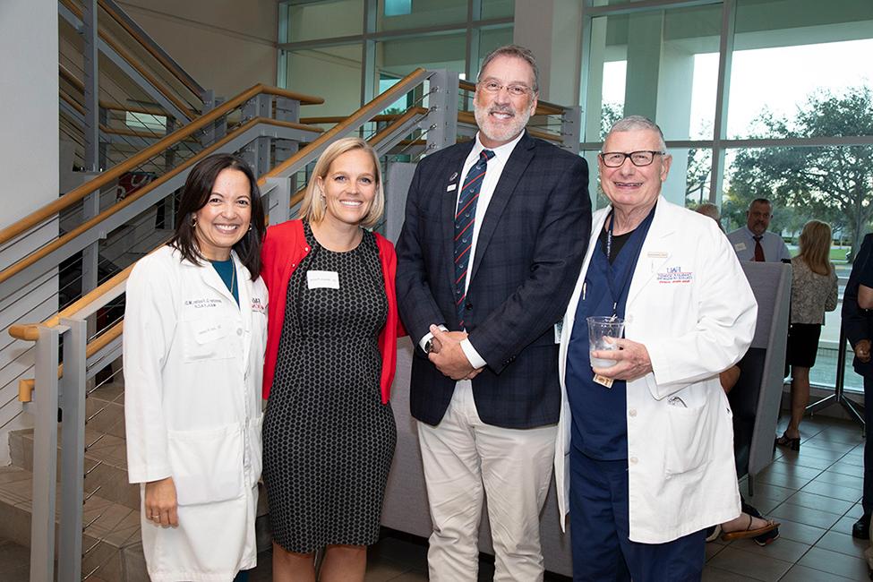 Interim Dean Curtis Whitehair, Dr. Lawrence Brickman, Dr. Allison Ferris, and Dr. Jennifer Foster at Ceremony