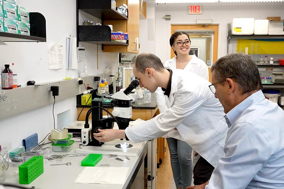 Dr. Marc Kantorow with graduate students in research lab